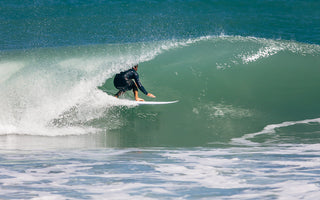 Jupiter Surfer pulling into a barrel