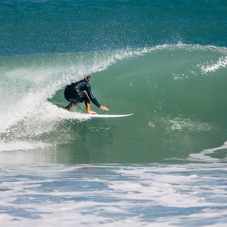 Jupiter Surfer pulling into a barrel