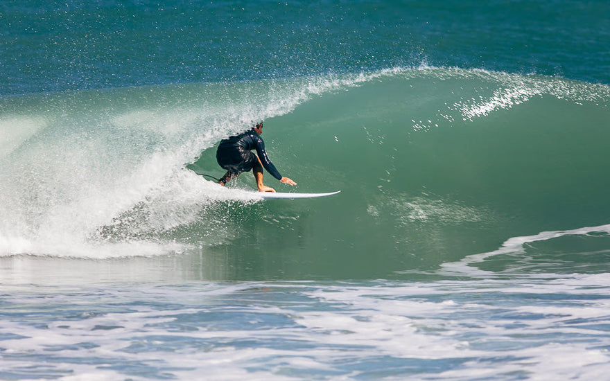 Jupiter Surfer pulling into a barrel
