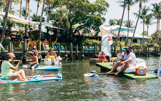 Race officials prepare paddlers for the Whatever Floats Your Boat event at Guanabanas in Jupiter, Florida.