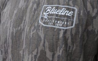 Blueline Surf and Paddle Co established 2010 on a Mossy Oak Camo T-shirt