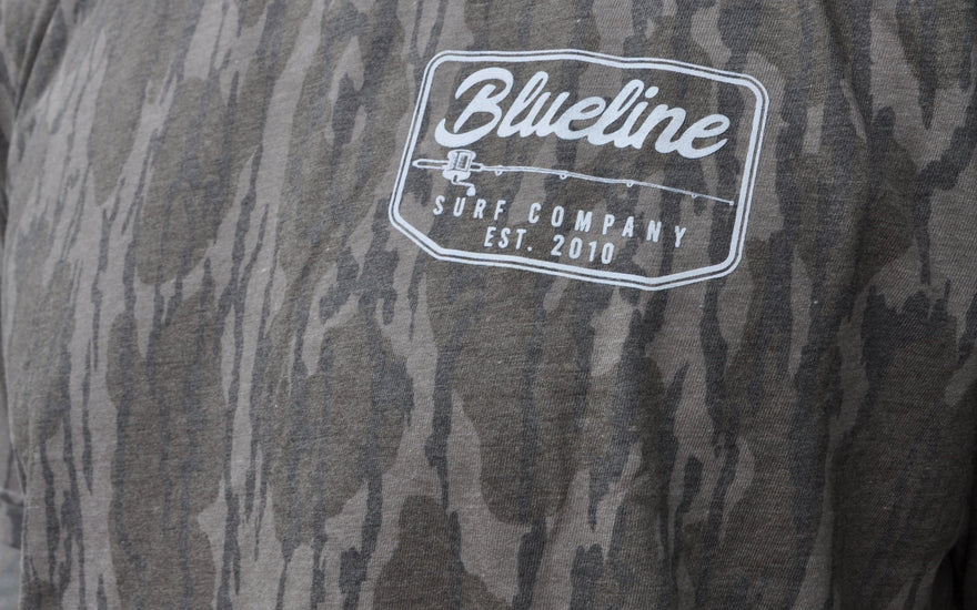 Blueline Surf and Paddle Co established 2010 on a Mossy Oak Camo T-shirt