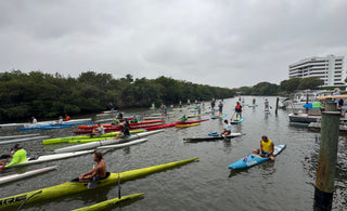 paddle crafts line up at Guanabanas in Jupiter, Florida for Tuesday Night Race League. Paddle crafts such as prone paddleboards, outrigger canoes, surf skis, Va'a and stand up paddlebaords are pictured.
