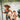 Paddleboarder wearing a sombrero and fake mustache holds a small dog while posing on the dock during the Cinco De Mayo themed Tuesday Night Race League event at Guanabanas in Jupiter, Florida.