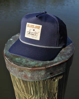 Hats built for the golf course by Blueline Surf and Paddle, two men at a mini golf course dressed in golf attire. 