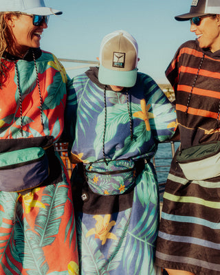 Nomadix changing poncho designed for beach days, surfing, paddleboarding, boating, travel, and outdoor adventures.