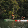 Steve Miller and Jake Portwood of Flying Fish Paddle Co. competing on the water during Blueline’s Tuesday Night Race League, a paddleboard weekly race series in Jupiter Florida. 