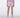 A model shown from the back wearing light purple/lavender athletic shorts.