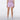 A model shown from the back wearing light purple/lavender athletic shorts.