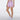 A model wearing light purple/lavender athletic shorts with a drawstring waist.