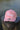 Blueline Kids Surfboard Tech Hat in Pink Heather and White displayed outdoors in Jupiter, Florida.