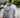 Man wearing a white and gray Blueline OG Circle UV sun hoodie standing on a dock in Jupiter, Florida.