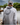Man wearing a white and gray Blueline OG Circle UV sun hoodie standing on a dock in Jupiter, Florida.