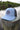 Blueline OG UV Lite Hat in Carolina and Navy with signature patch on dock in Jupiter Florida – front view