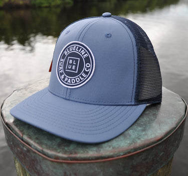 Blueline OG UV Lite Hat in Slate and Navy with signature patch on dock in Jupiter Florida – front view