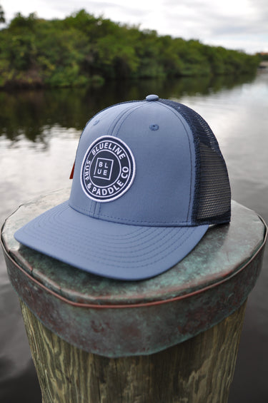 Blueline OG UV Lite Hat in Slate and Navy with signature patch on dock in Jupiter Florida – front view