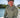 Man wearing Vintage Blueline Logo ANETIK Low Pro Tech Hoody in olive while boating in Jupiter, Florida