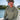 Man wearing Vintage Blueline Logo ANETIK Low Pro Tech Hoody in olive while boating in Jupiter, Florida