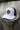 Blueline OG UV Lite Hat in White and Black with signature patch on dock in Jupiter Florida – front view