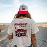 Blueline Women’s Christmas Crop T-Shirt 2025 Natural worn on Jupiter beach with holiday truck graphic – back view