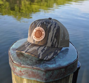 Blueline OG Leather Patch Trucker Hat – Mossy Oak Bottomland / Loden