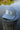 Gray hat state of florda with a square and the word blue. 
