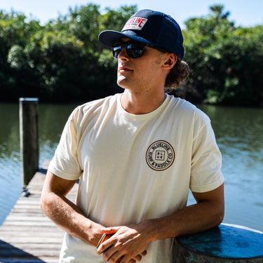 OG Blueline Logo T-Shirt and Blueline Hat on a dock in South Florida