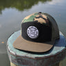 OG Blueline black camo loden flat bill hat on dock in Jupiter Florida