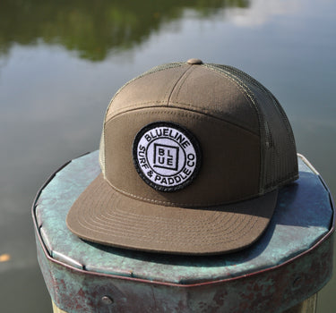 OG Blueline dark loden flat bill hat on dock in Jupiter Florida