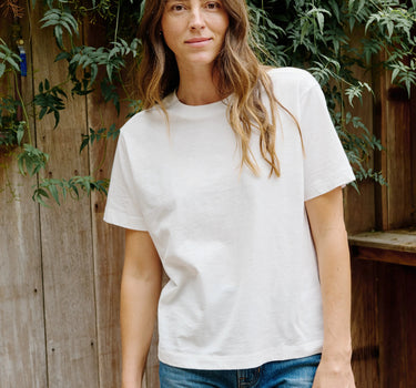 Woman wearing the Outerknown Saltwater Slub Tee made from Regenerative Organic Certified® cotton with a relaxed fit and lightweight slub texture.
