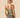 Woman wearing an Outerknown Sojourn Island Lea tank top back view