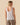 Outerknown Windswept gauze tank women’s lightweight breathable summer top relaxed coastal style back view on model.