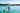 Paddleboarder wearing a Blueline hooded UV sun shirt on the Intracoastal Waterway in Jupiter, Florida