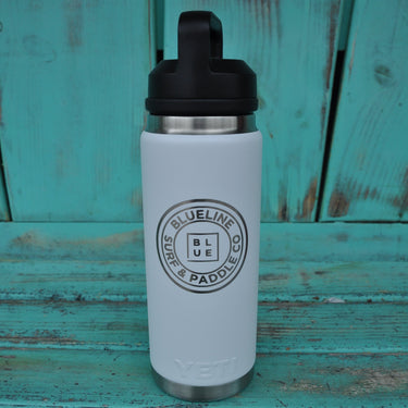 YETI x Blueline 36 oz white chug bottle with Blueline Surf & Paddle Co logo.