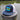 Navy and white Bahamas flag trucker hat by Blueline Surf & Paddle photographed on a dock piling overlooking the Jupiter Florida waterfront.