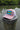 Bahamas Lobster Eco Hat in dried rose and white displayed waterfront in Jupiter Florida