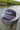 The Blueline America 250 TriTech performance rope hat in navy blue featuring water-resistant hydrophobic fabric, a contrast front rope, and laser-perforated side panels, photographed in Jupiter, Florida.