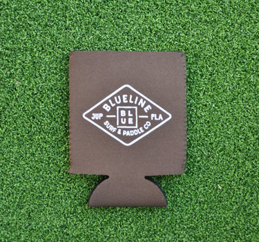 Brown neoprene Blueline diamond logo koozie with white print displayed on grass