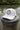 White Blueline FlexFit performance hat featuring the embroidered Blueline Circle Logo, designed for boating, golf, paddleboarding, fishing, and outdoor adventures in Jupiter, Florida.