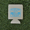 Natural neoprene Blueline Hunt Club koozie with light blue boar hog and palmetto graphic displayed on grass