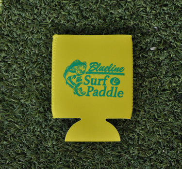 Yellow neoprene Blueline jumping mahi logo koozie displayed on grass