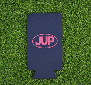 Navy neoprene Blueline JUP slim can koozie with pink logo displayed on grass