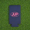 Navy neoprene Blueline JUP slim can koozie with pink logo displayed on grass