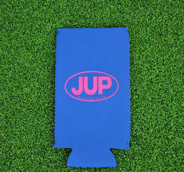 Royal blue neoprene Blueline JUP slim can koozie with pink logo displayed on grass