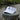 Blueline Lighthouse Visor in White featuring the embroidered Jupiter Lighthouse logo, designed for paddleboarding, boating, golf, and everyday coastal living.