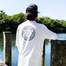 Blueline OG Circle UV Long Sleeve Sun Shirt – White / Gray, worn on a dock in Jupiter, Florida