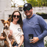 Couple wearing Blueline OG Circle UV sun hoodies in heather denim and true navy standing outdoors in Jupiter, Florida.