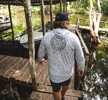 Blueline OG Circle UV Sun Hoodie – Heather Smoke Camo, worn on a dock in Jupiter, Florida