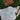Women's Blueline Shell Crop Tee in natural featuring a coastal shell graphic, styled with a straw hat and sandals on the grass.