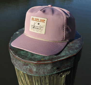 Blueline Skiff rope hat in dried rose photographed along the Intracoastal in Jupiter Florida